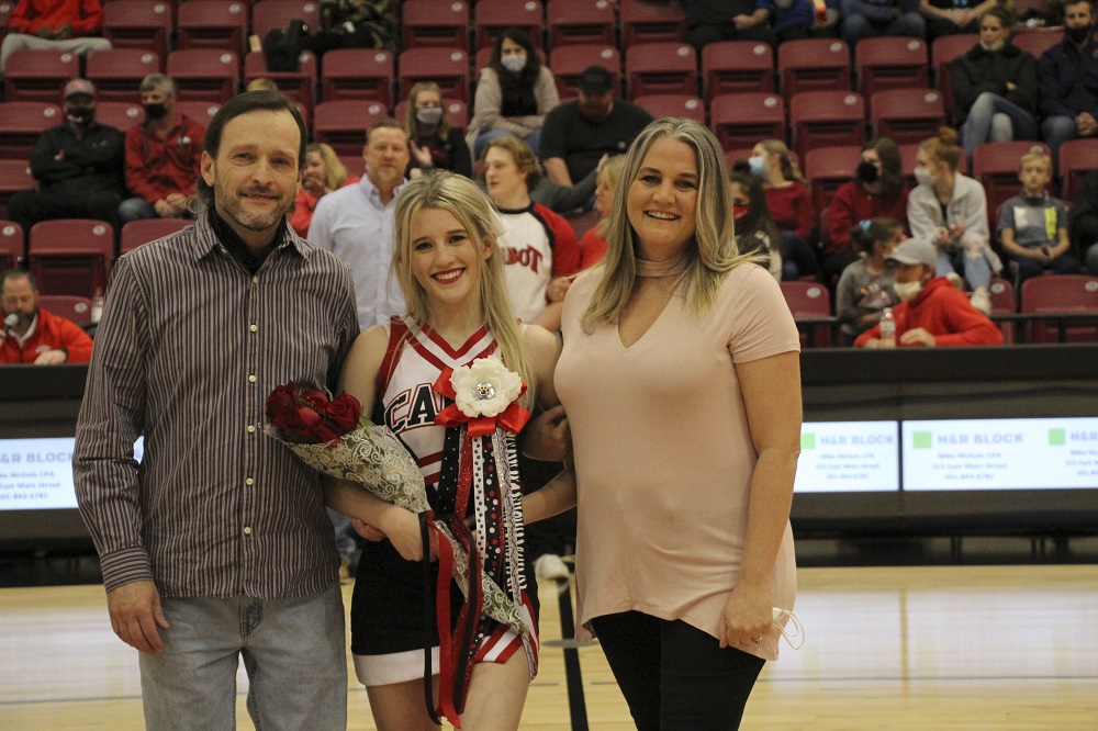 Cheer senior with parents being recognized for senior night 2021